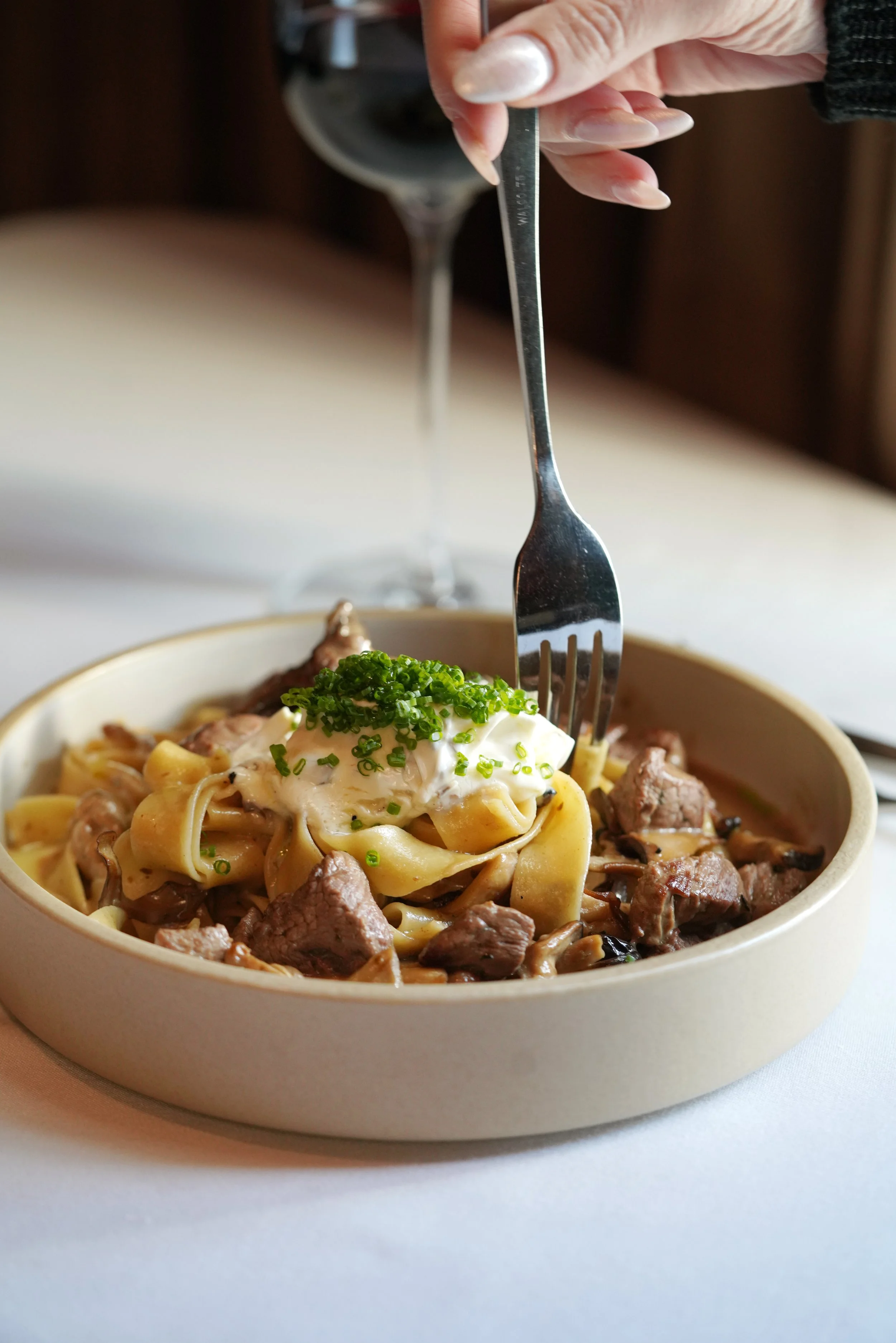 A plate with roasted chicken, mashed potatoes, grilled carrots, and garnish at level 2 fine dining steakhouse in branson missouri