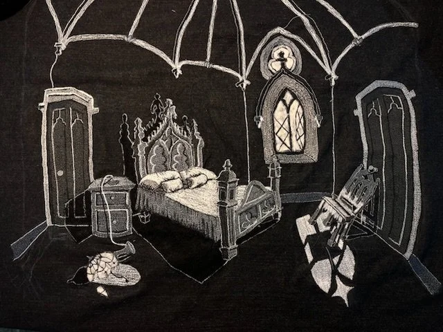 The Ache of the Wind on the Window, 2025. Polyester thread, black denim, wool, lint. 18 x 28 in.
