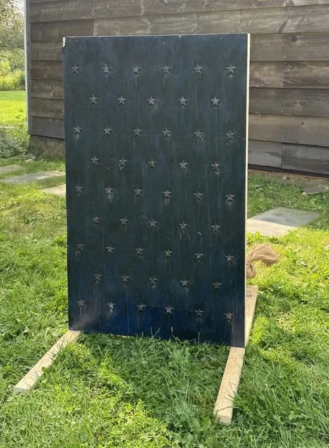 Thomas Lail, Untitled (Flag for R.L.), 2020/2026, Enamel and polymer on pallet wood, sandbags, 41 x 31 x 40 in
