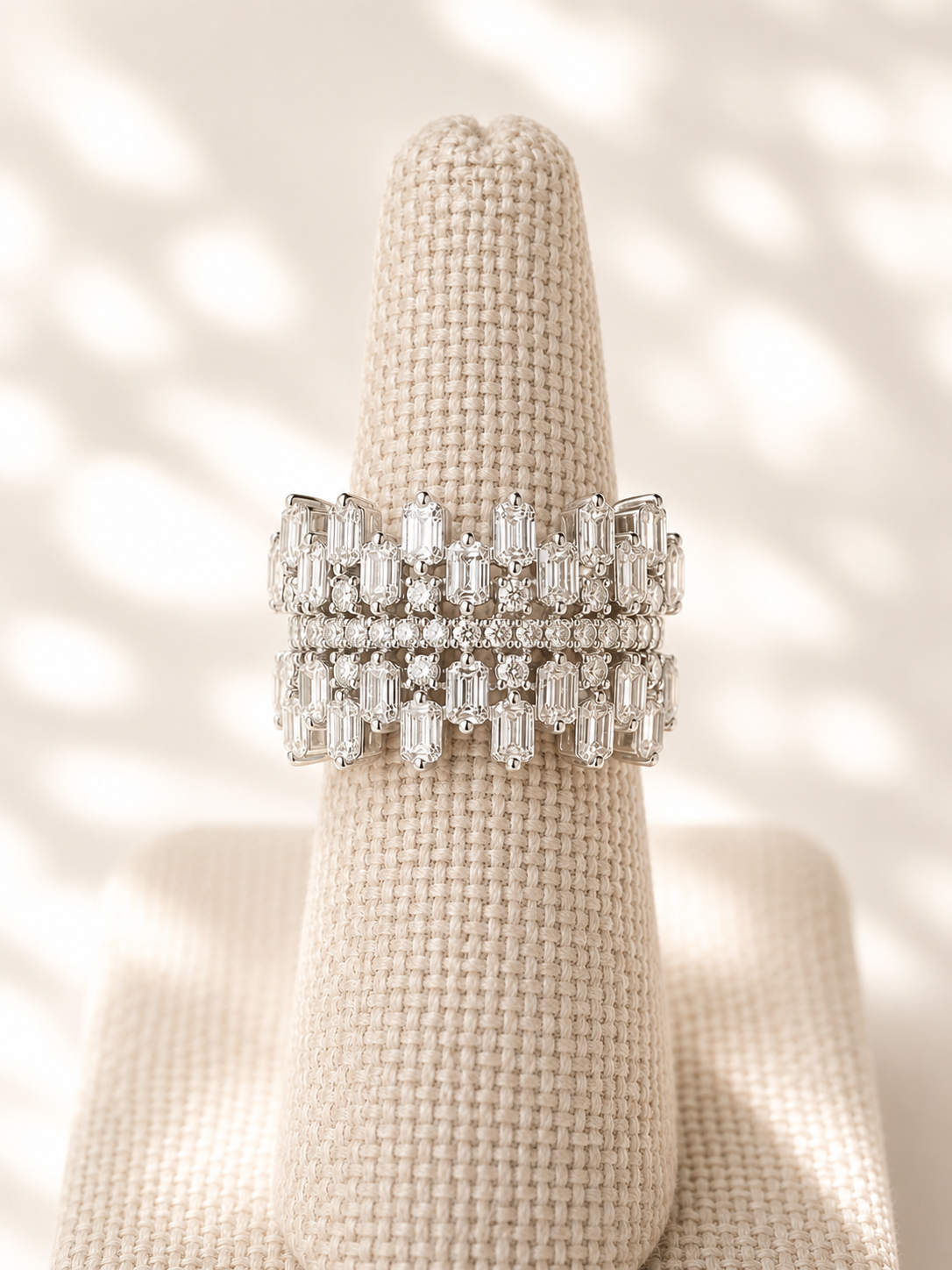 Tiered diamond ring on stand 9.1.26.png
