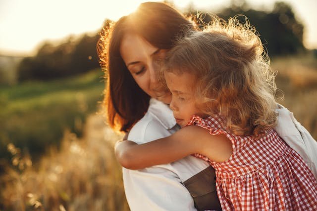 woman holding her child