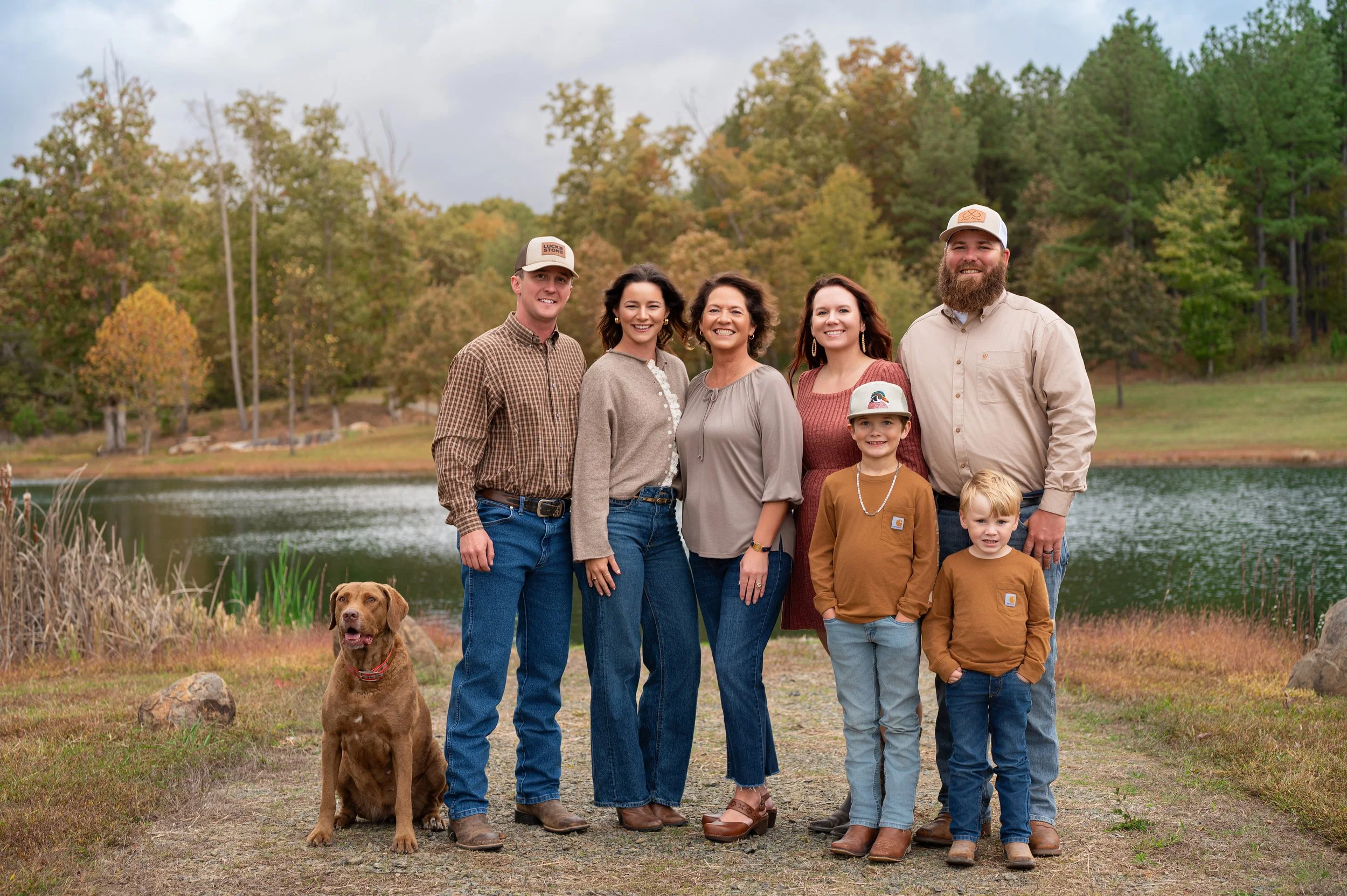 family of eight, including three children and a dog, standing outdoors danville VA