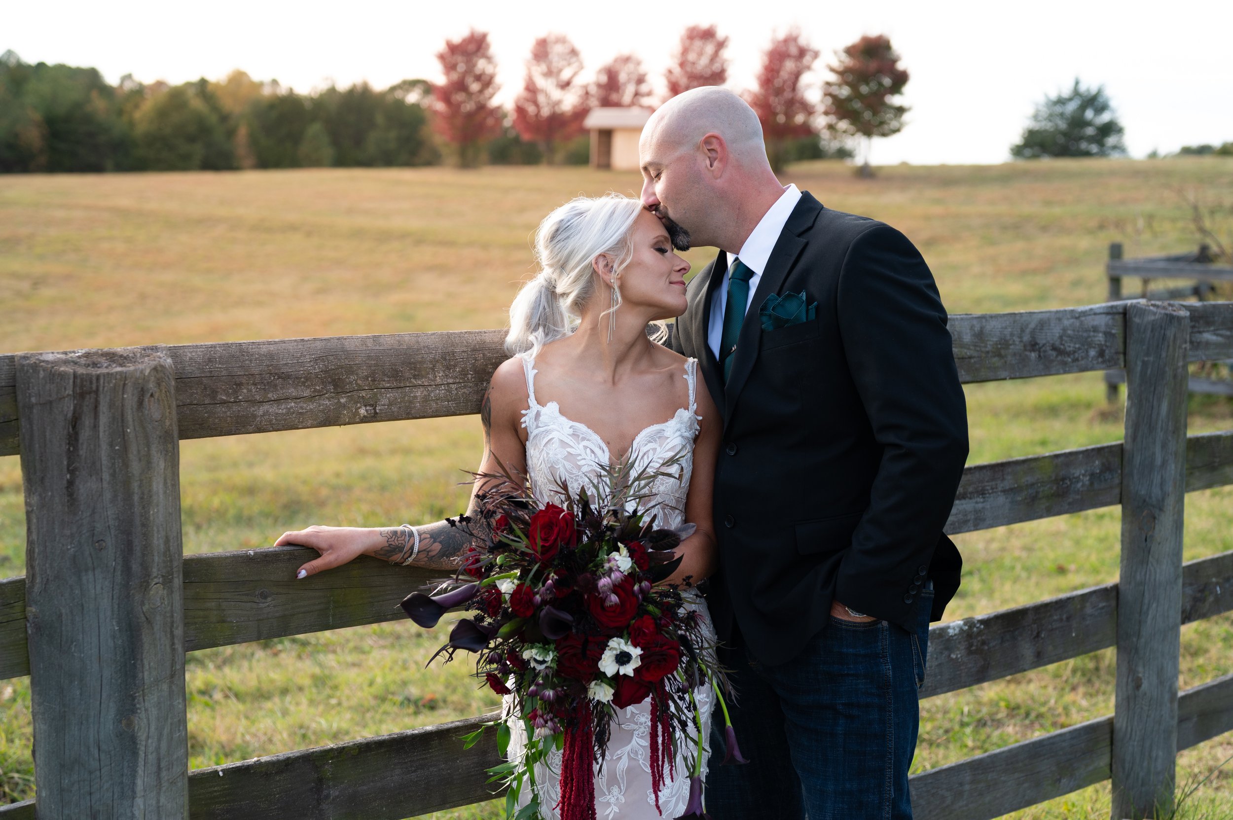 A bride and groom sharing an intimate moment outdoors at sunset photography Danville, VA
