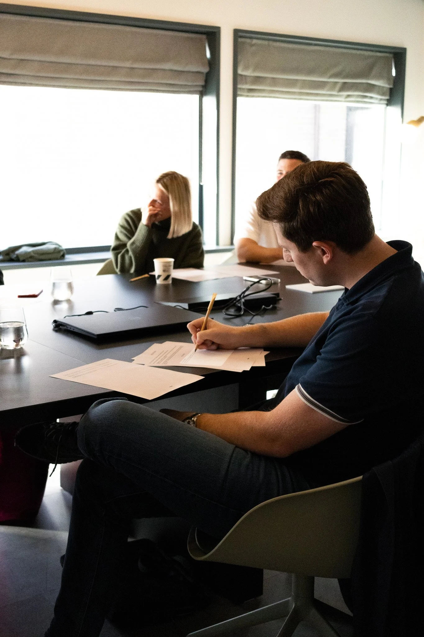 boardroom meeting taking notes.