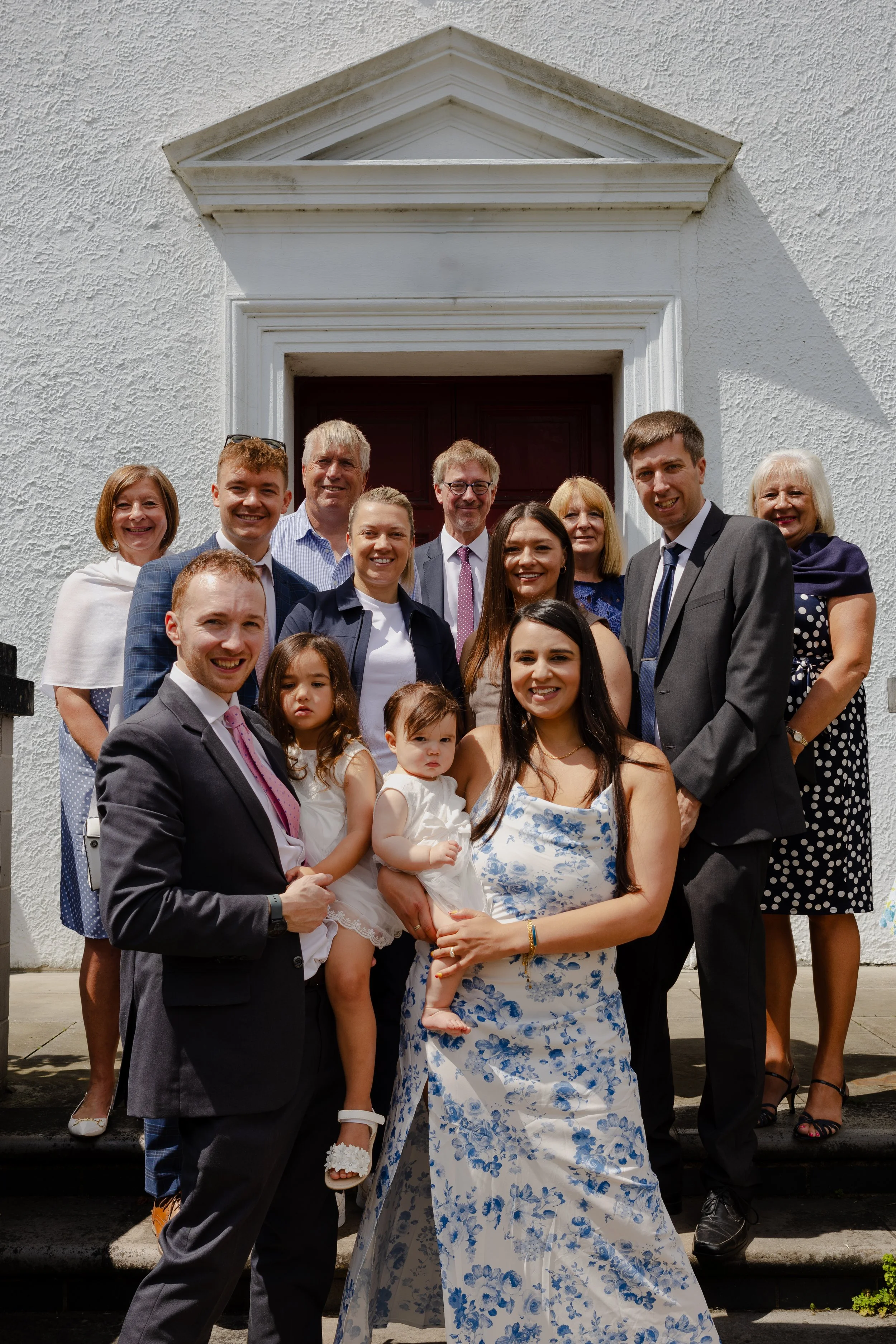 family photo at christening in the summer