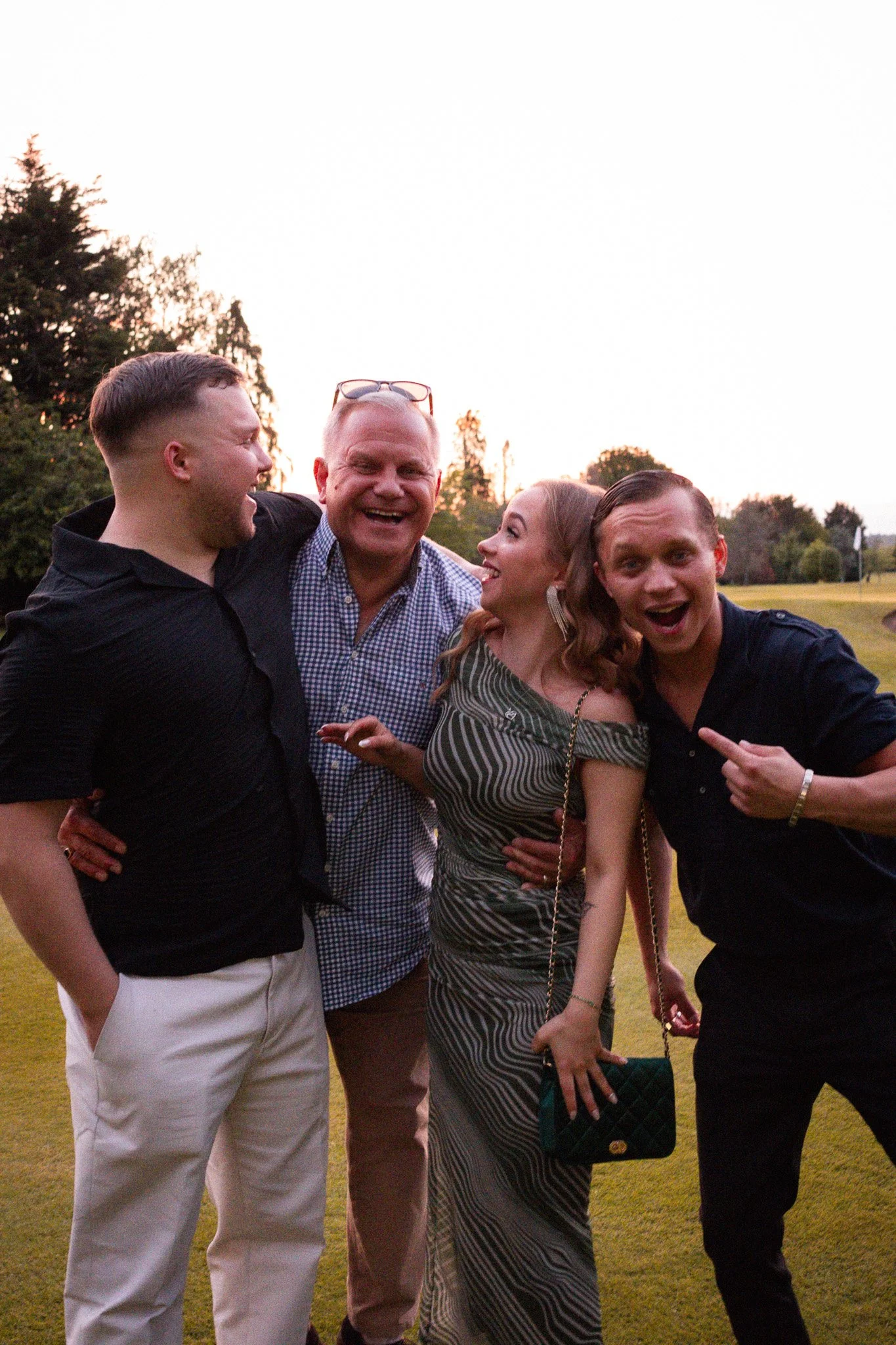 family laughing at birthday party together.
