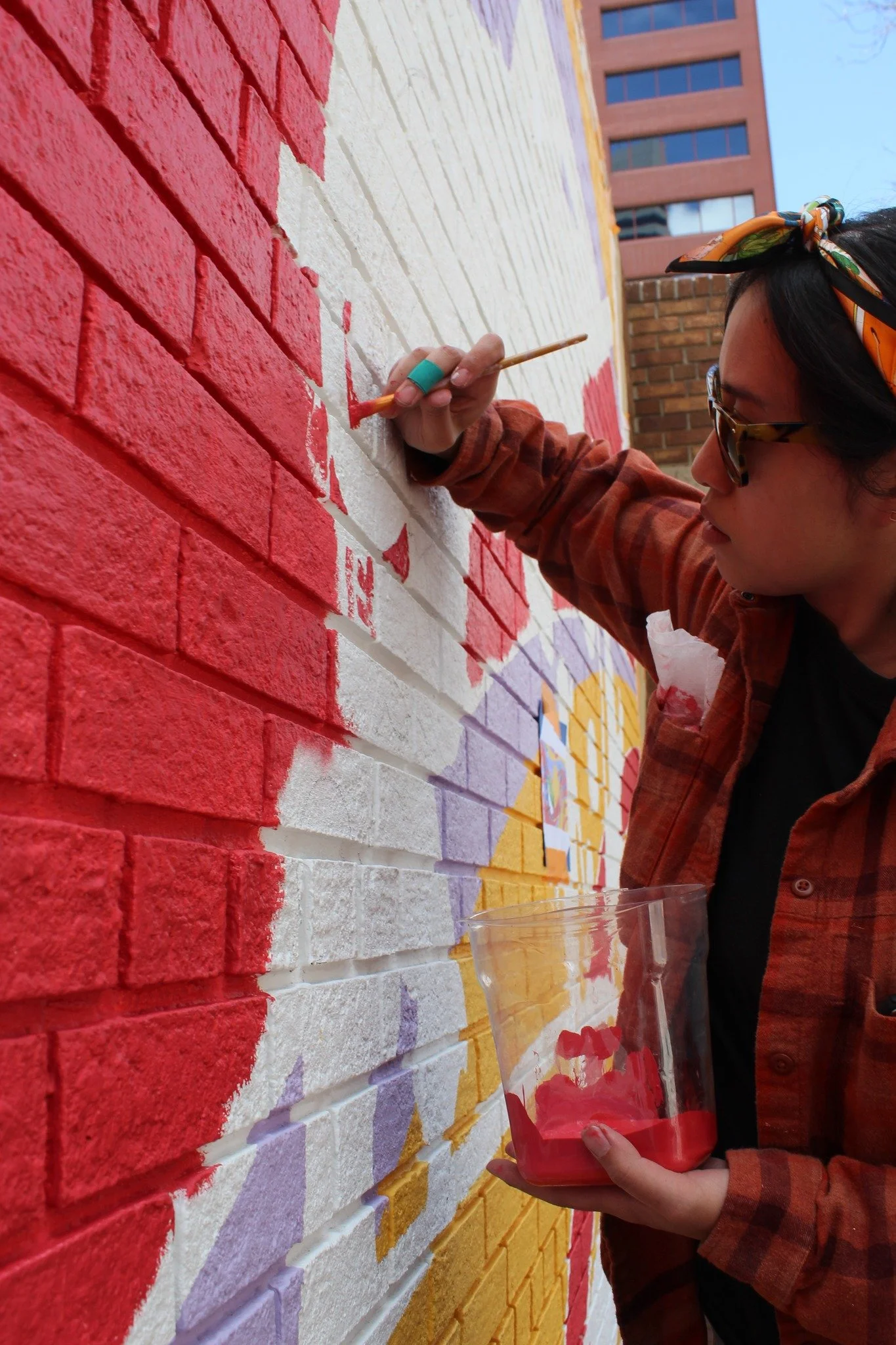 Nalye focused on painting her new exciting mural