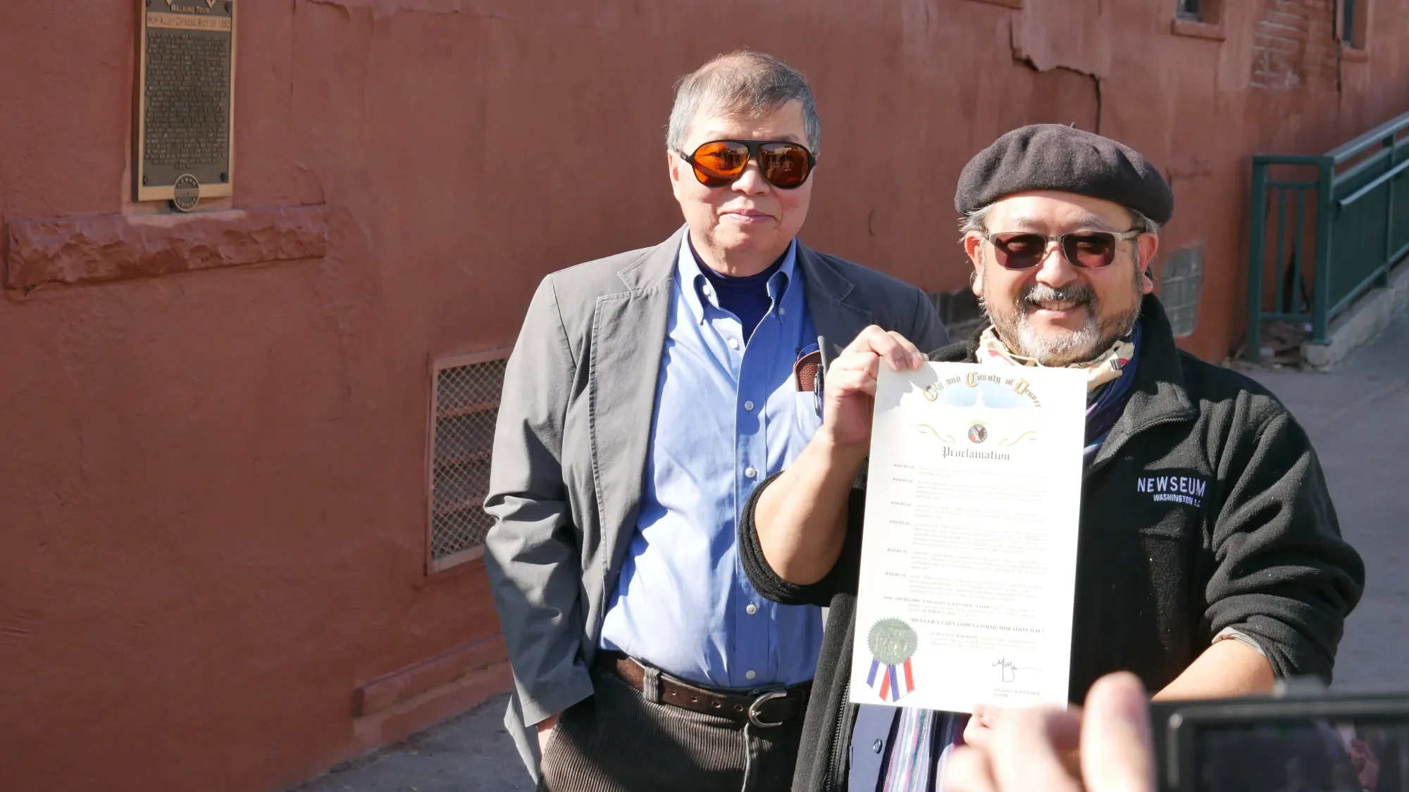 A plaque near Denver’s historic Chinatown marks a race riot. Its critics see it as an opportunity