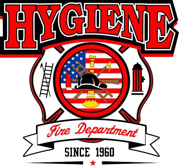 A Fire Department emblem with a central shield displaying firefighting tools, an American flag, and a fire hydrant, surrounded by a black helmet, ladders, and a badge. The top features the word 'HYGIENE' in bold red letters, and below the emblem is a banner with 'Fire Department' written in red, along with the text 'Since 1960' and a small red star.