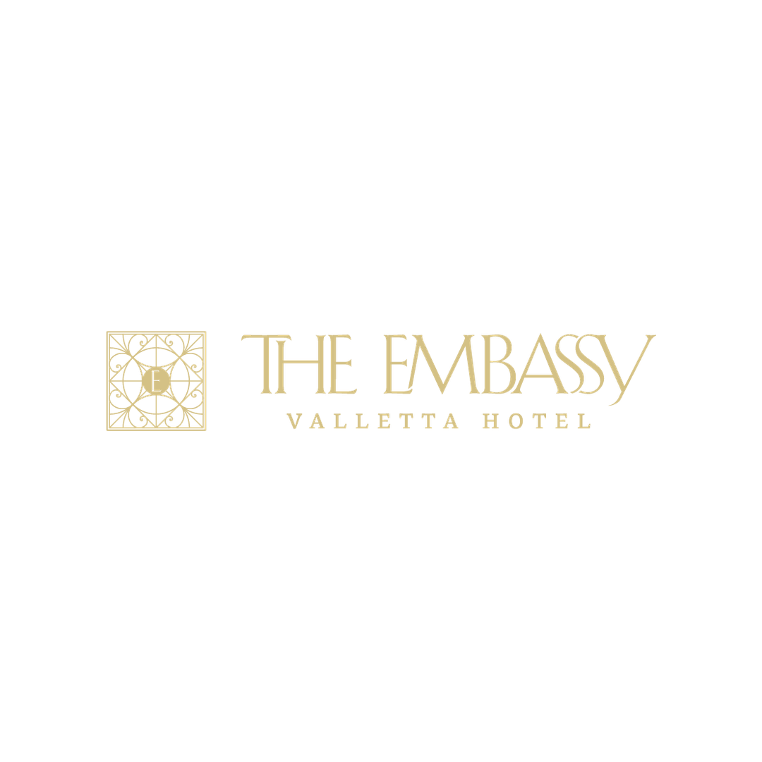 Gold The Embassy Valletta Hotel logo on a black background
