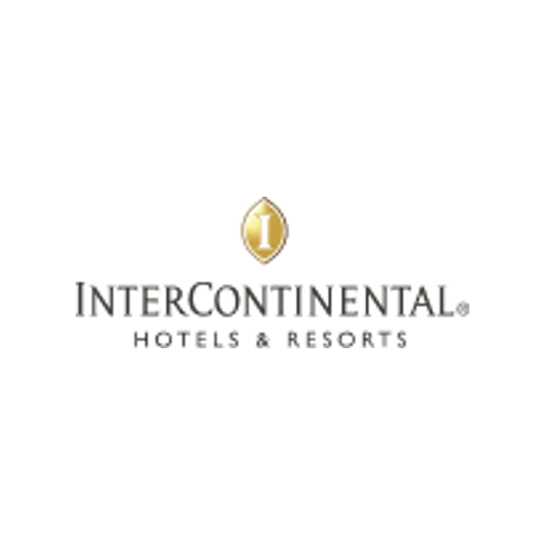 Intercontinental Hotel Group logo with gold IHG emblem and gray text on a black background