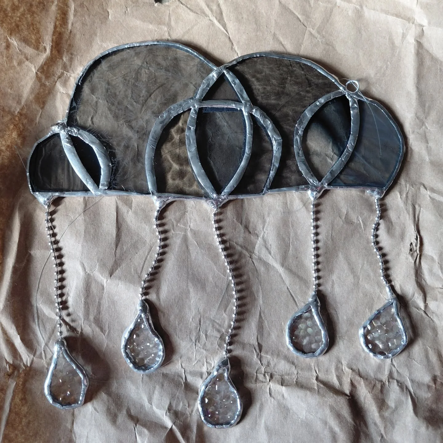 I made my own stained glass rain cloud! I've been wanting to try this for years now,  and i finally did. Mistakes were made but i didn't cut myself out burn myself.  so i think i did pretty good.  what do you think?