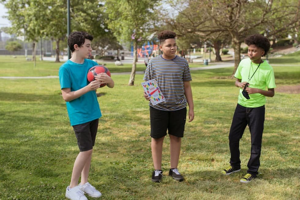 boys-standing-on-grass