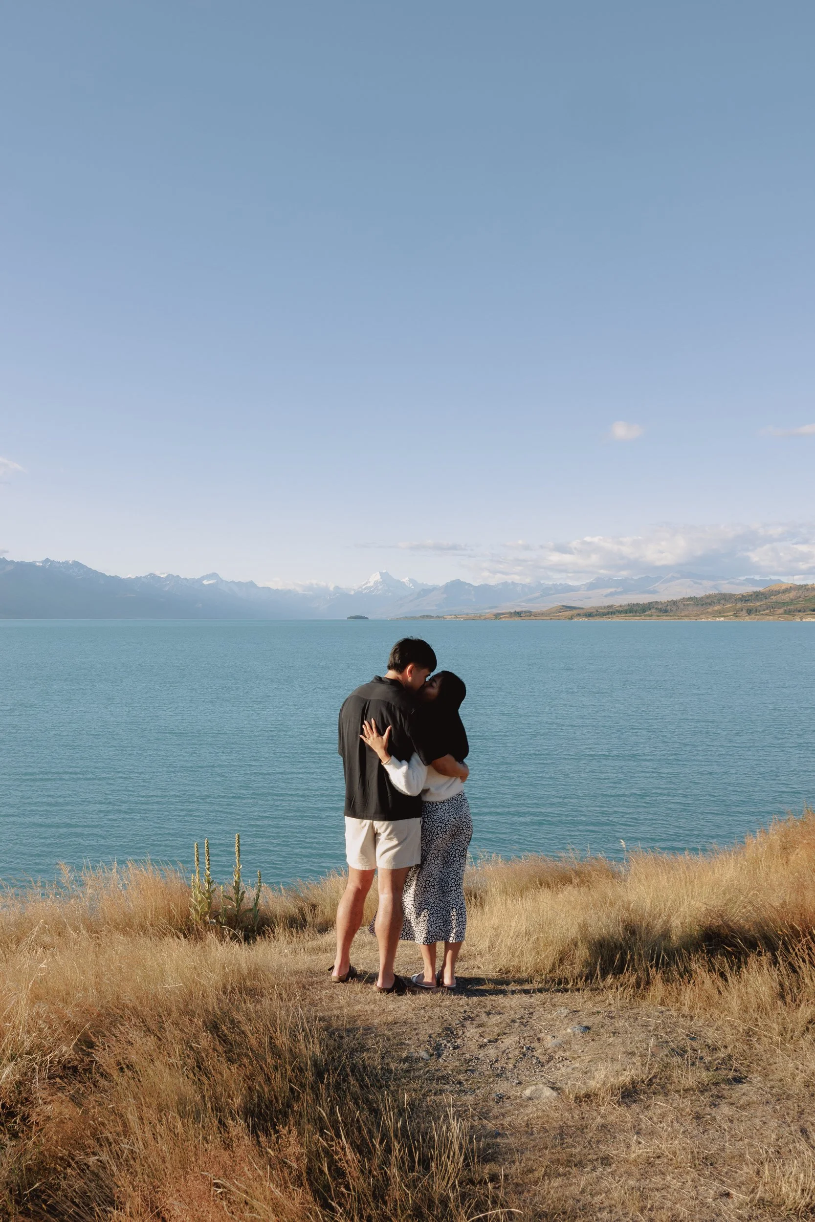 Proposal moment Lake Pukaki — destination engagement photography