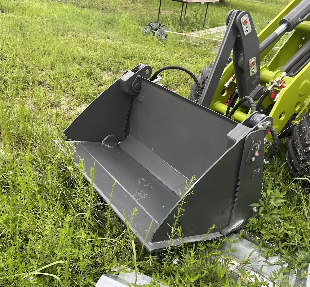 4-in-1 Bucket for L1400 electric loader — Nesher Equipment