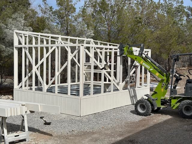 One man, one electric loader, and a complete construction project