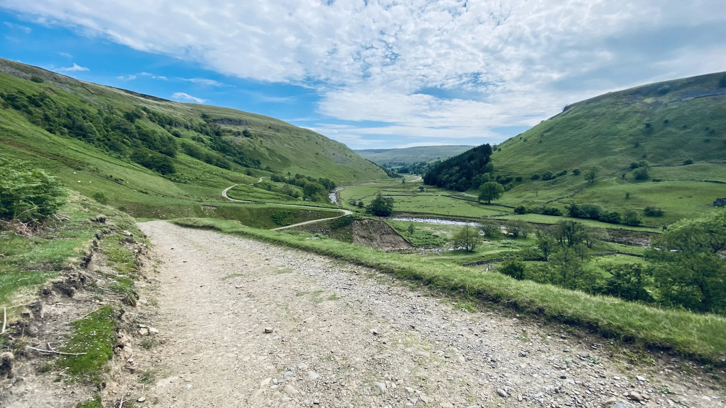 Pennine 500 track along the River Swale in Swaledale in the southern loop of the bikepacking route