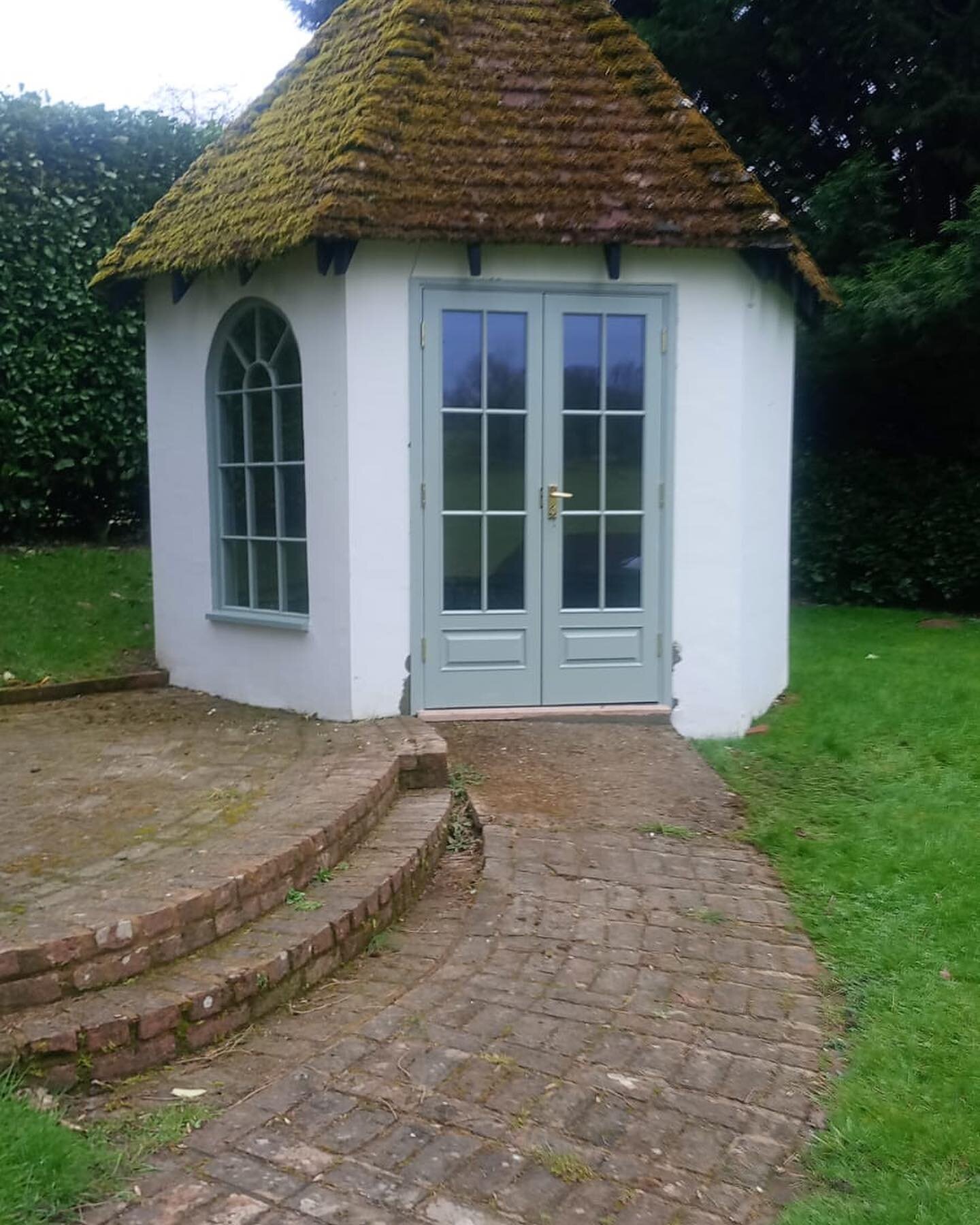 The prettiest of little summer houses in our Hampshire project&hellip; we had new doors and a window made, re rendered and painted in @farrowandball Pigeon and School house white to match the rest of the house. 
The roof was so pretty we kept it as i