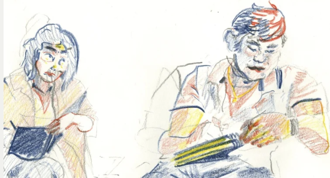 Students drawing each other drawing