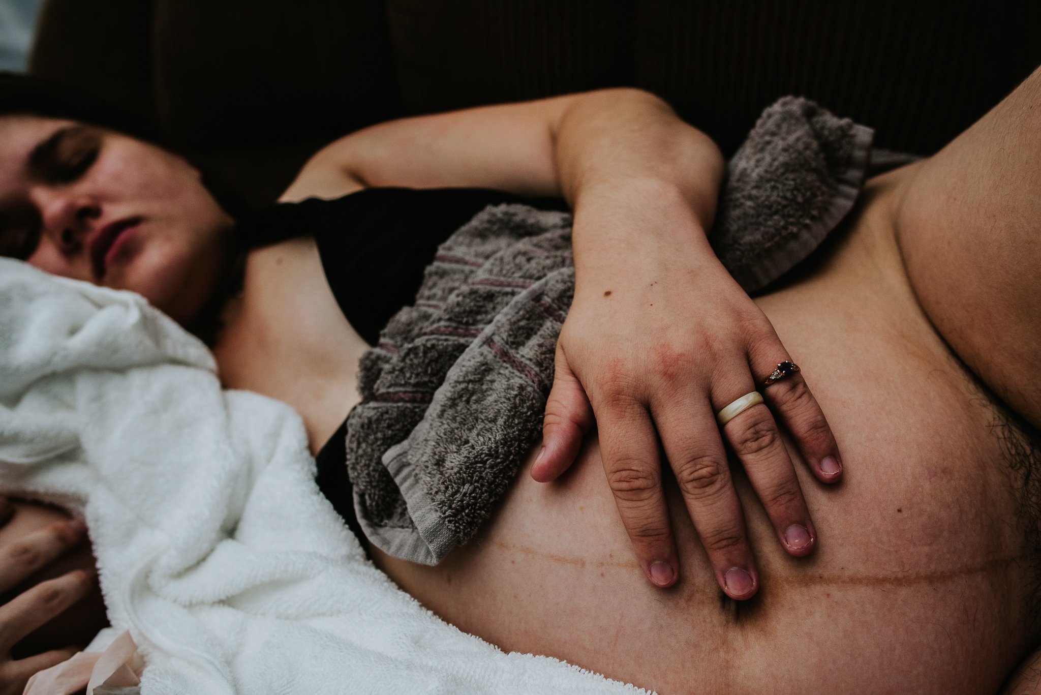 touch-holding-pregnant-belly-during-labor.jpg
