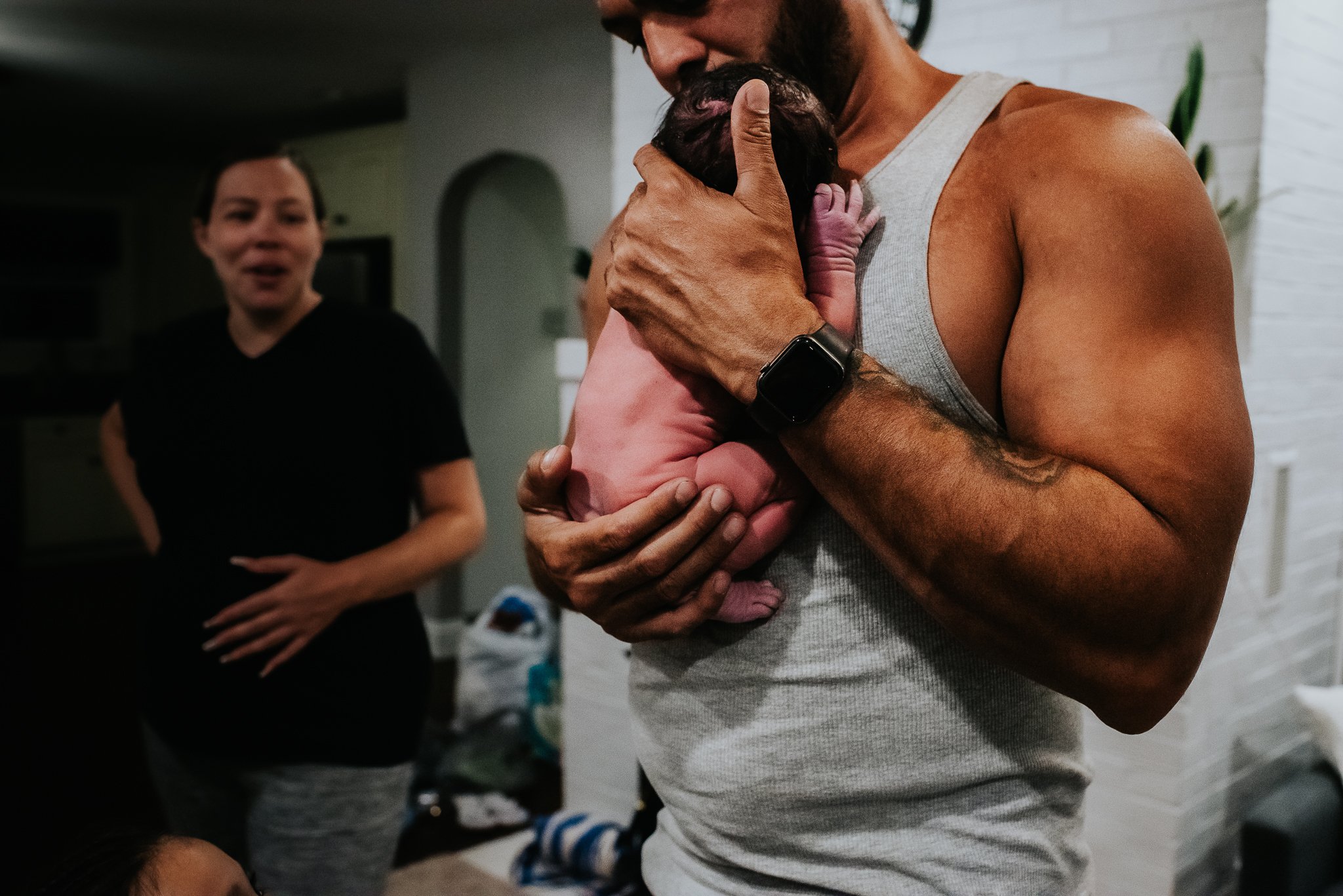 Badger-and-Quill-Photography-documents-new-father-holding-newborn-in-central-PA