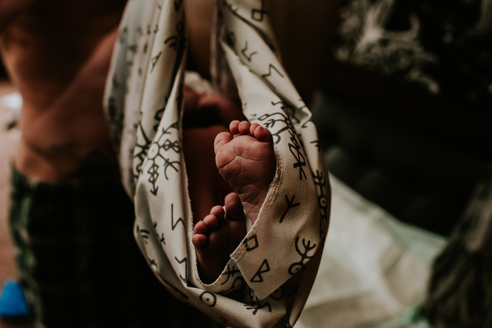 Newborn-exam-feet-sticking-out-of-sling-during-weighing-central-PA