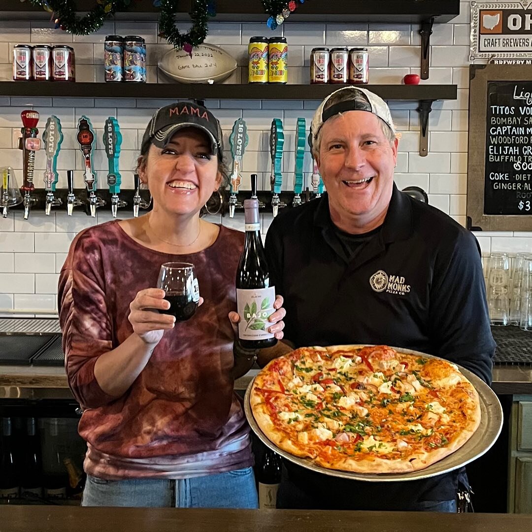 Pairing Pizza with Wine- perfect combo!  Our Roasted Red Pizza, with red sauce, mozzarella cheese, imported roasted red peppers, roasted chicken, ricotta cheese and fresh arugula&mdash; paired with a glass or bottle of Bajo Montepulciano D&rsquo;Abru