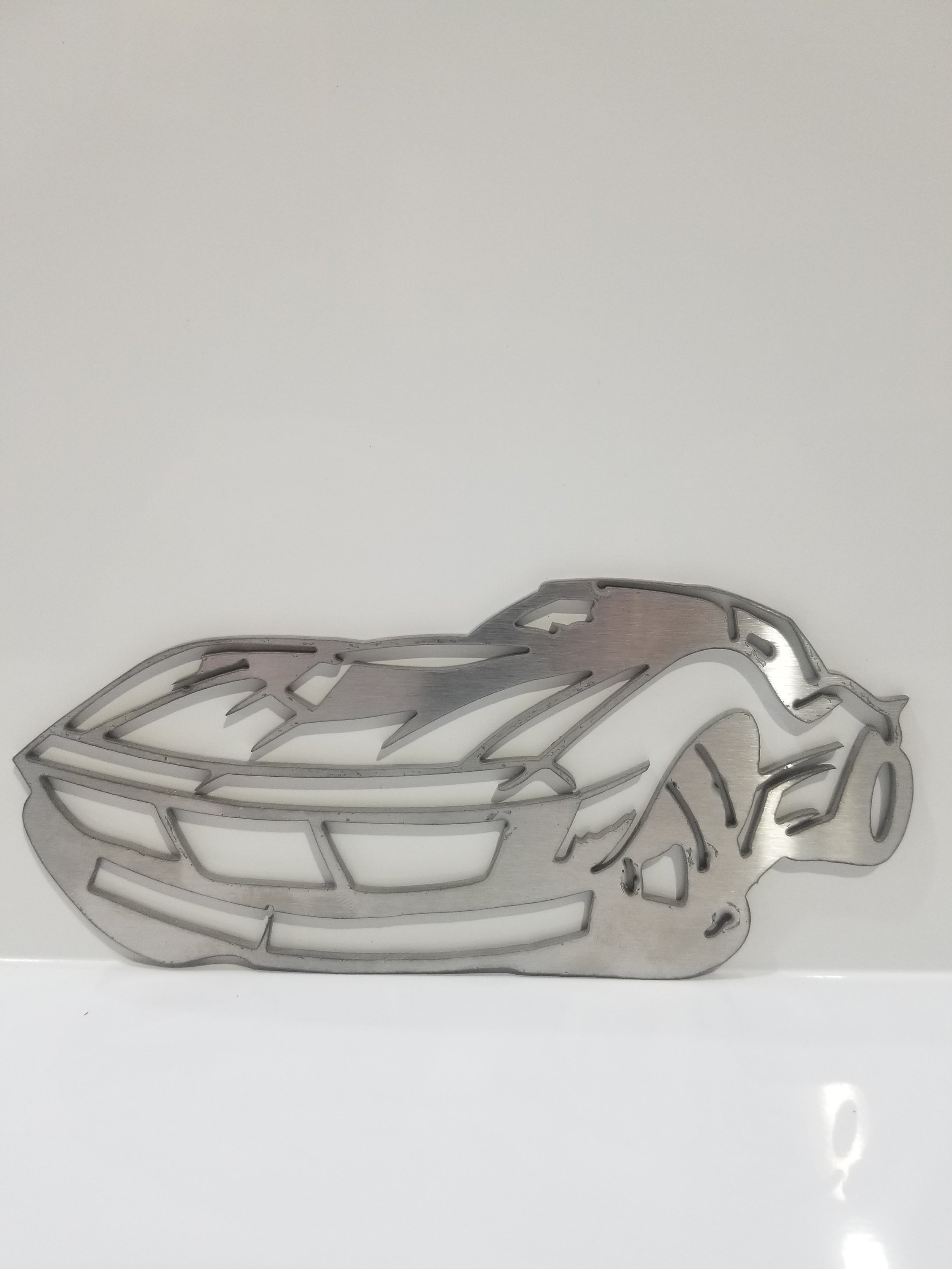 Corvette sports car wall plaque in stainless steel or aluminum defines you and your interests.