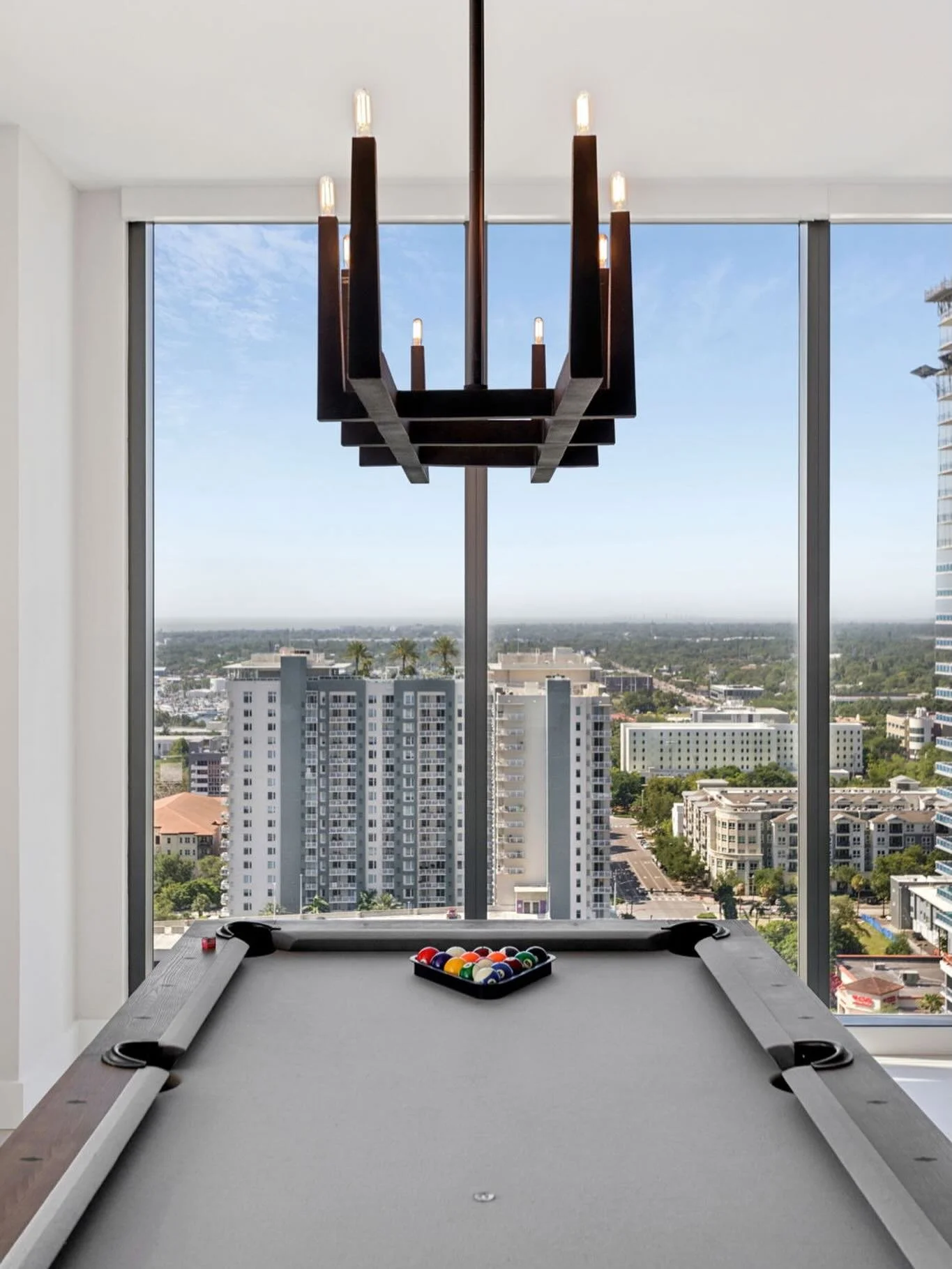 Dining room, reimagined. We swapped the traditional dining table for a custom pool table&mdash;designing the space around how our clients actually live: entertaining, unwinding, and making the most of that view.
#livableluxury #arthousestpete #stpete