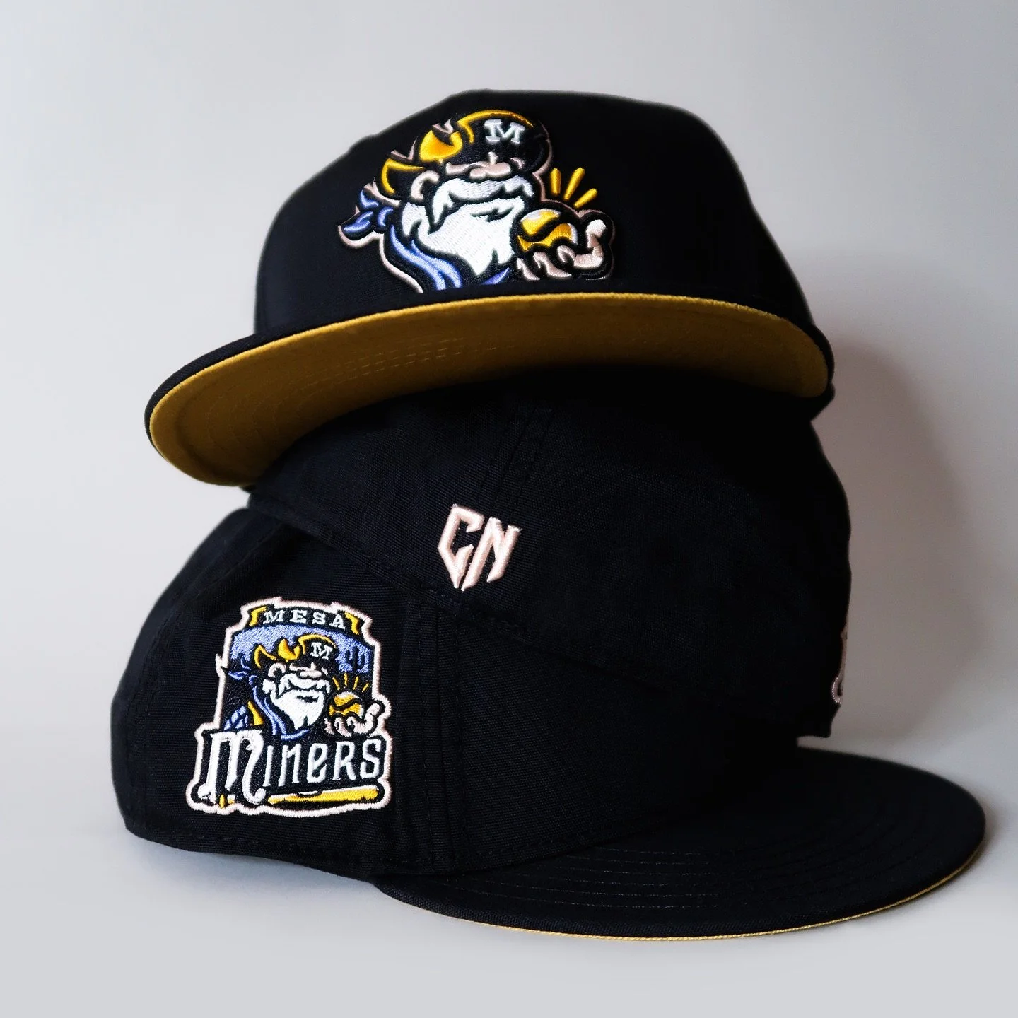 The Mesa Miners 🖤 

Reimagination of the original 2005 Mesa Miners on-field ballcap design. This fitted cap is sewn from soft polyester baseball cloth to give you a genuine on-field look. So will you be serving more than just a fastball in our Mesa 