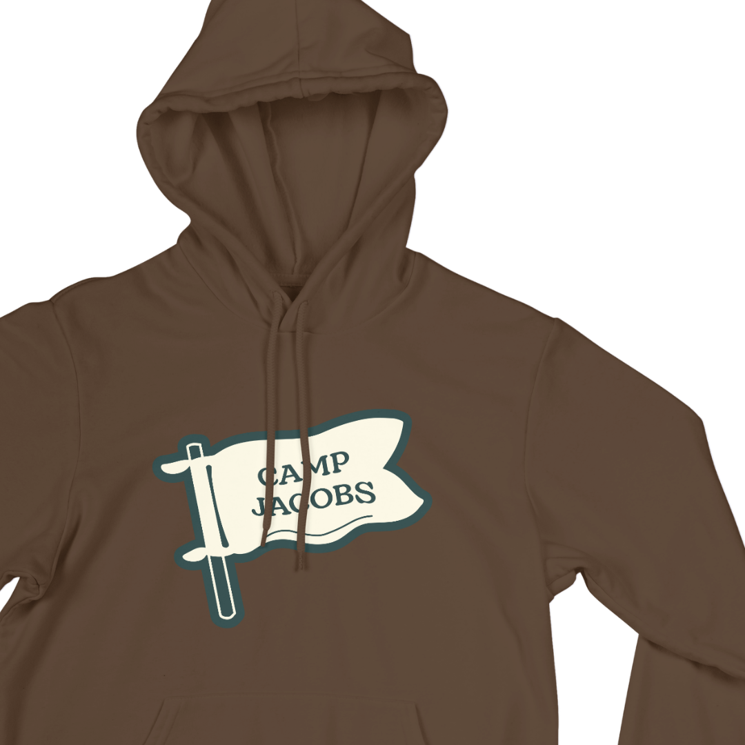 Brown hoodie with a white flag graphic and the text 'CAMP JACOBS' in black.