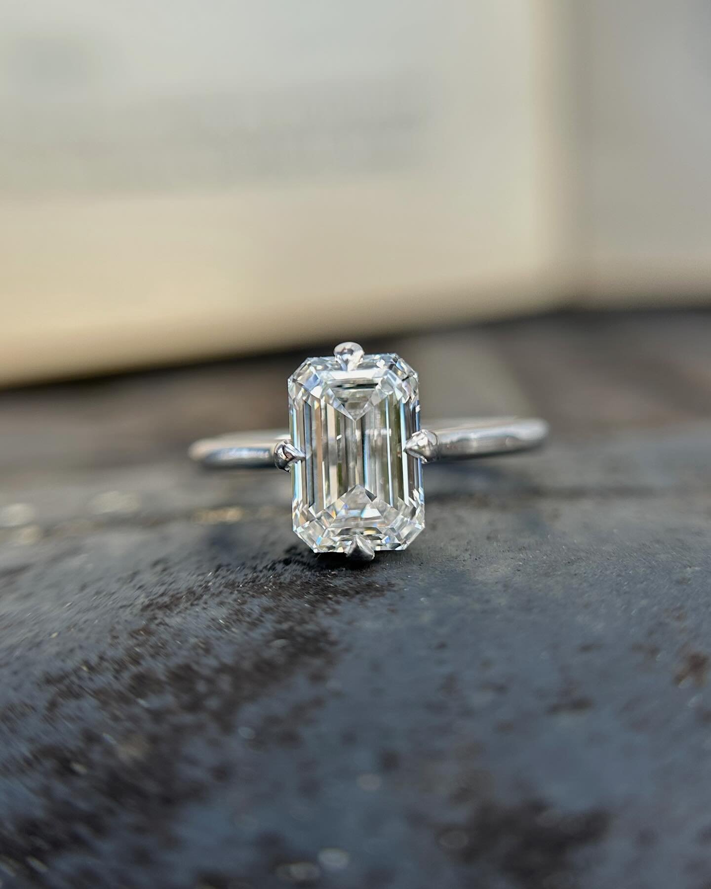 Congratulations Kiefer and Alexis! Here&rsquo;s a peak at their stunning emerald cut solitaire complete with compass prongs and hidden halo.