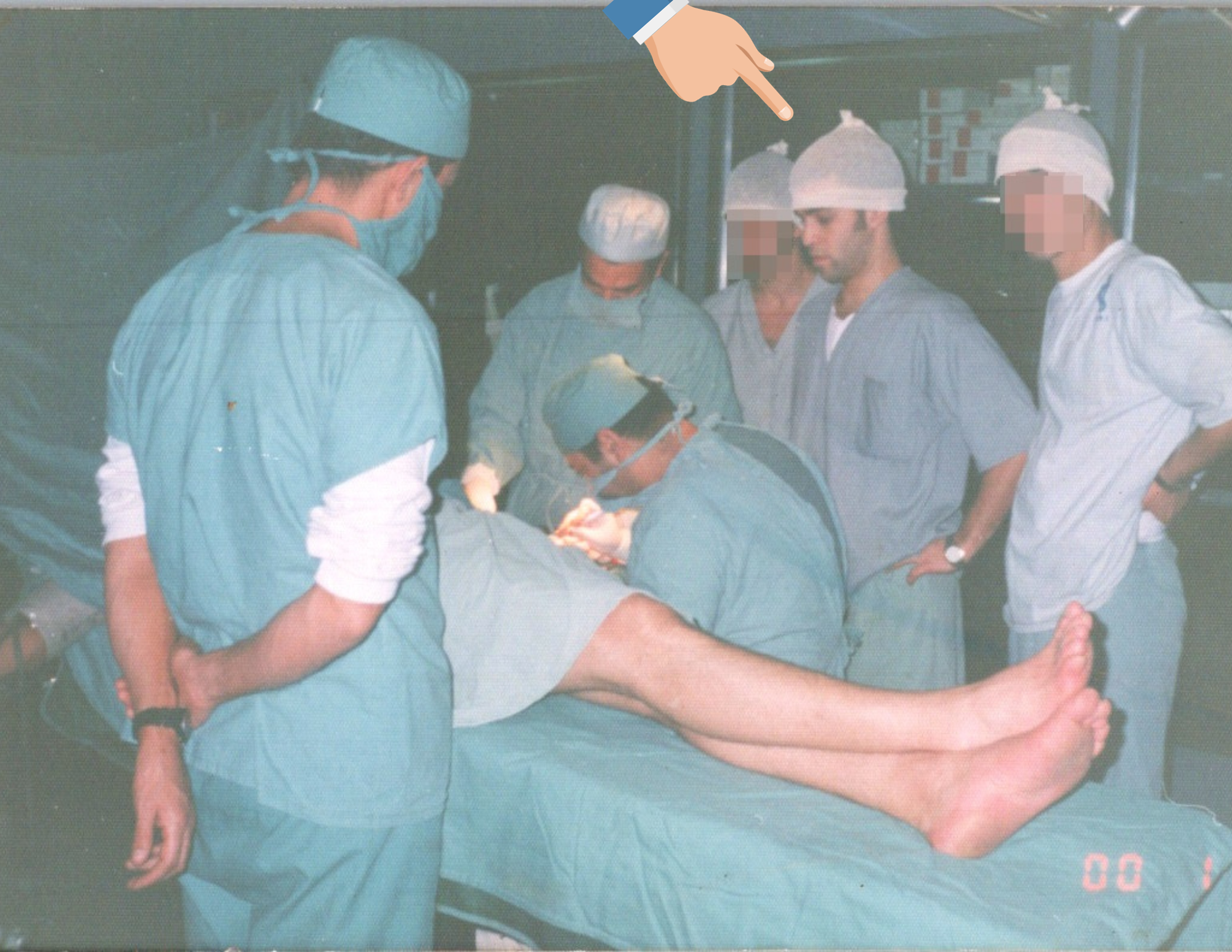 Medical team performing surgery on a patient in an operating room.
