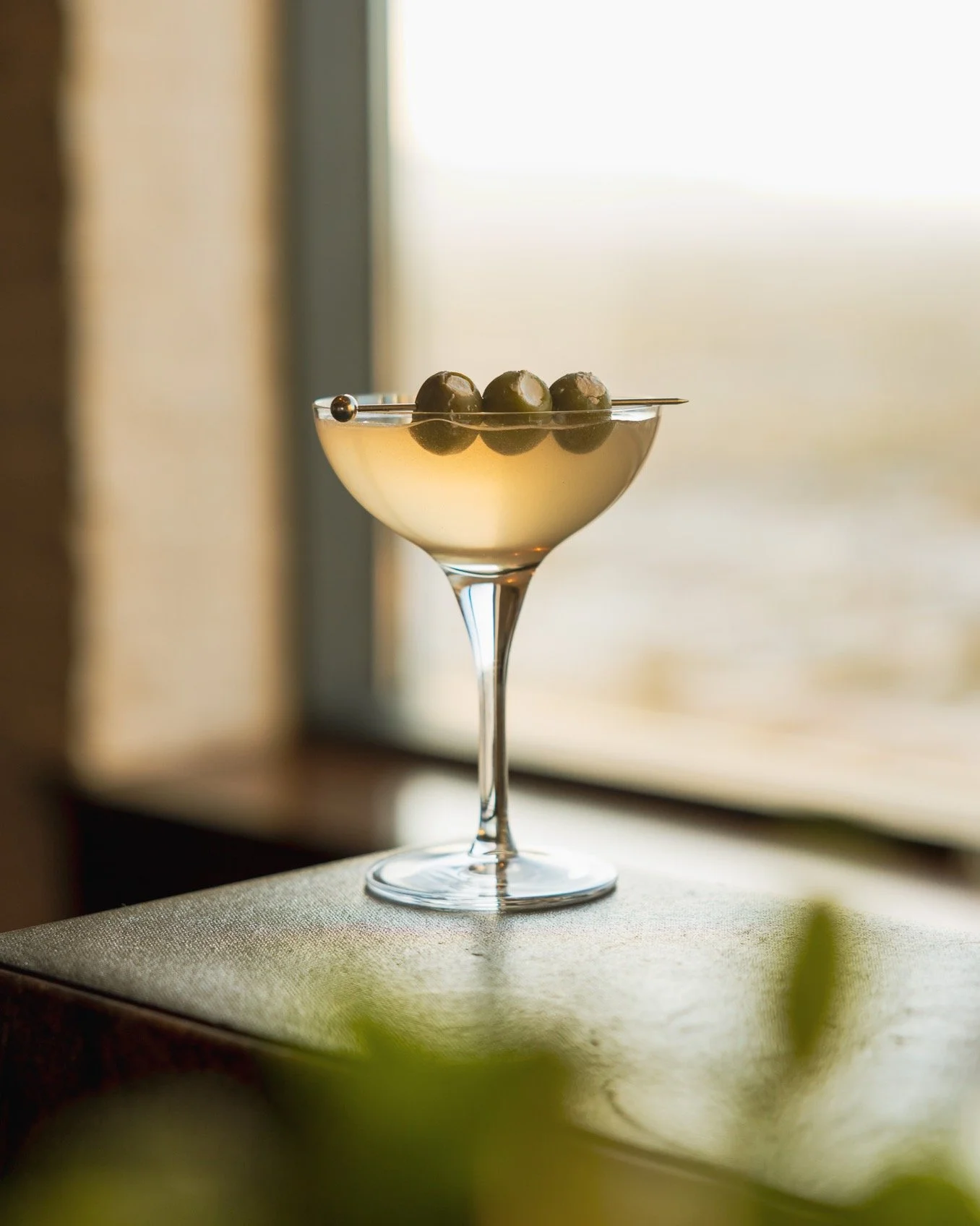 Cocktails just get us. 🍸 The drama, the garnish, the way the light hits the perfectly selected stemware...
.
Head-on cocktail shots are one of our go-to because nothing shows off the details quite like eye-level.
.
Bold, a little moody, and impossib