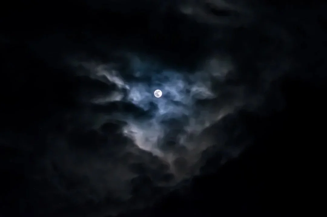 A moody header background featuring a cloudy, full-moon night sky, reflecting the aesthetic brand vision of a leading Las Vegas social media agency specializing in hospitality marketing.