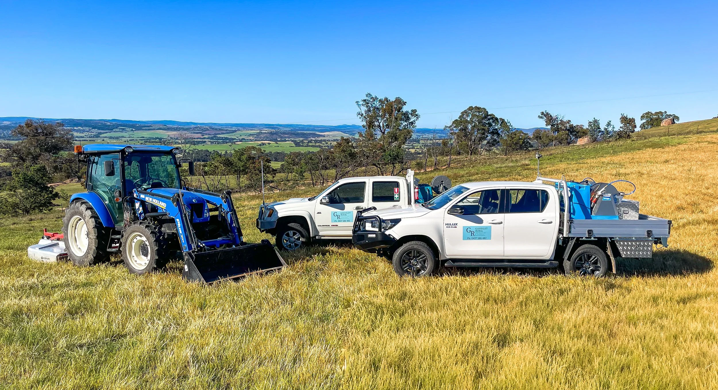 Goodlet Rural equipment and machinery including two ute's with spray units on the back one has dual spray unit capacity. New Holland tractor with slasher and bucket. Picture in West Bathurst.