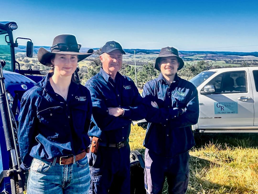 Goodlet Rural Team, wearing dark blue uniform and logo of Goodlet Rural with the tractor and ute with dual spray unit based in Bathurst NSW