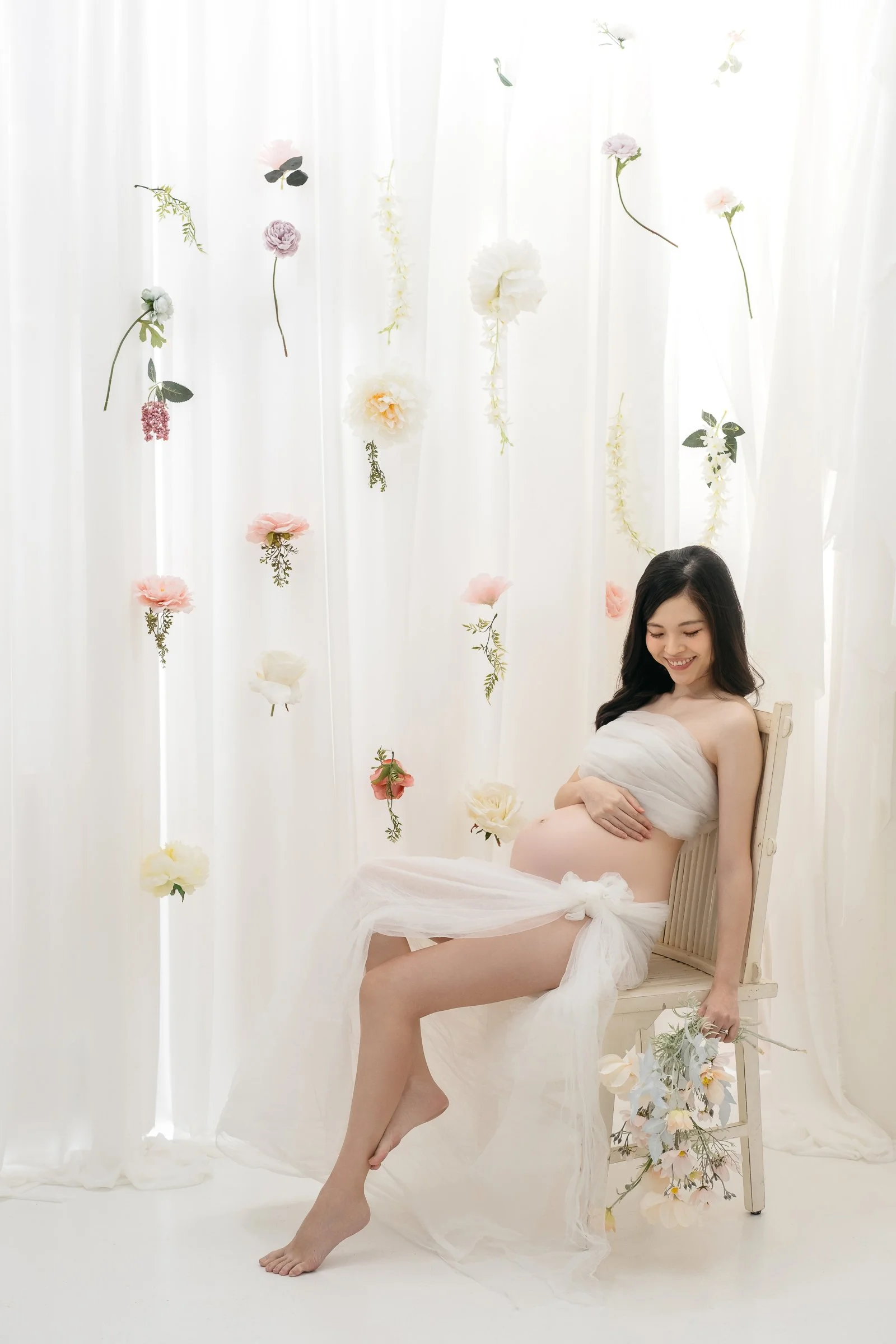 flower rain backdrop maternity photographer singapore
