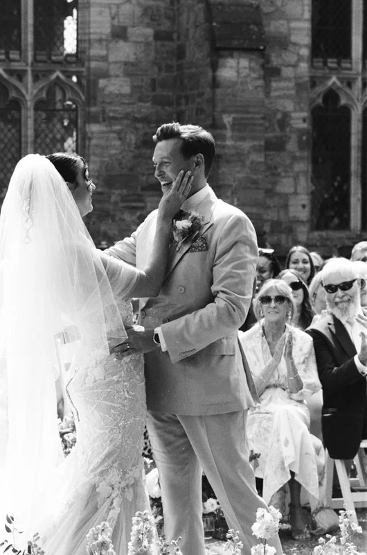 Grainy black and white wedding portrait shot on Ilford HP5 film with a Pentax K2