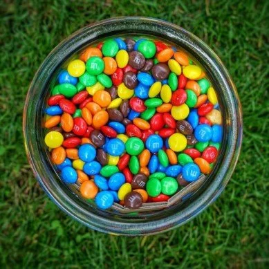 A jar of multicoloured  M&Ms
