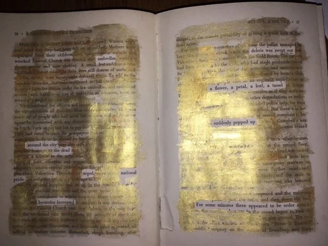 Gold paint on the pages of a book reveals a new text.