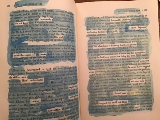 Blue and gold paint on the pages of a book reveals a new text.