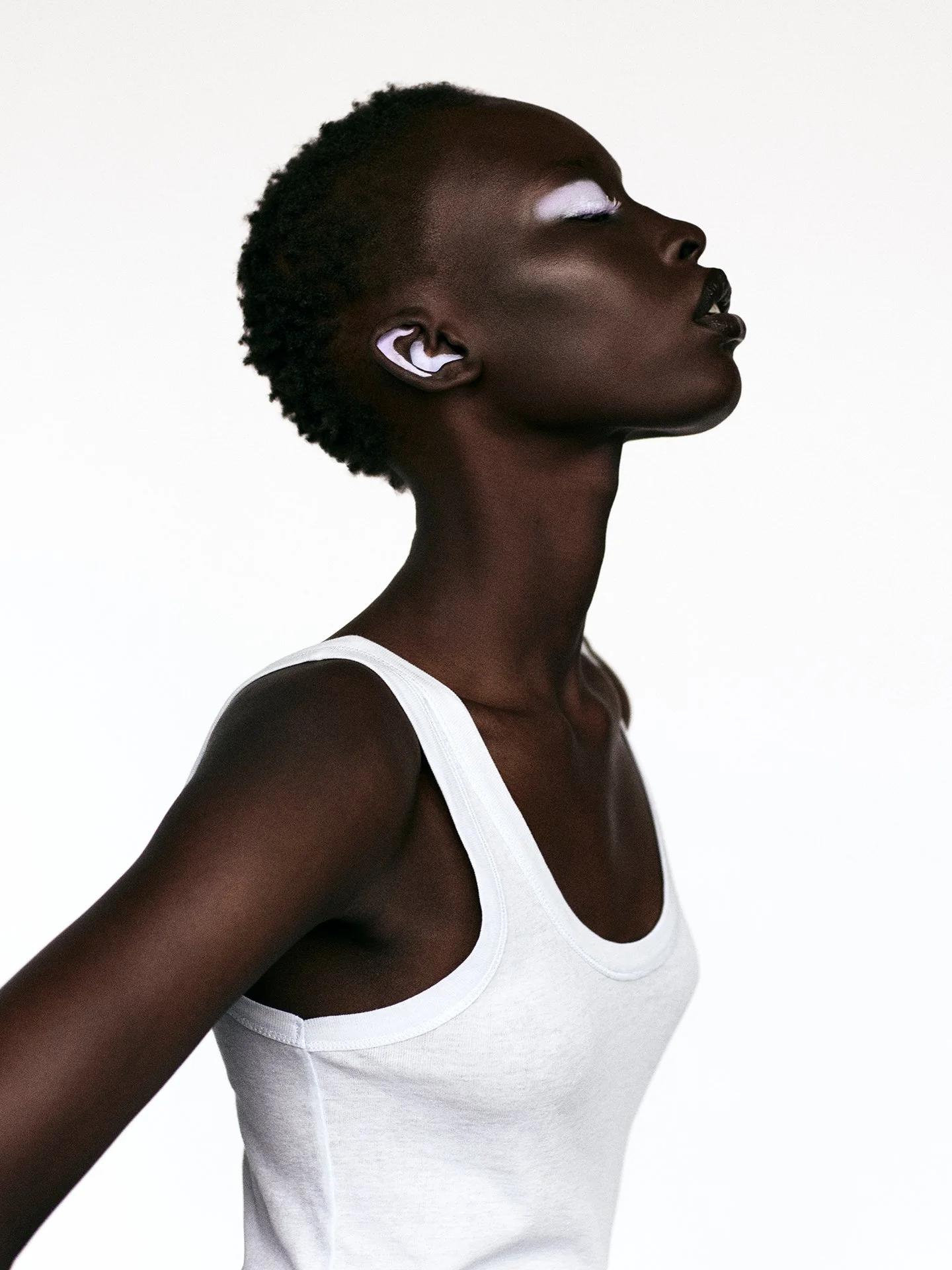 Minimalist beauty portrait with hoop earring by a beauty photographer available in London and across Europe