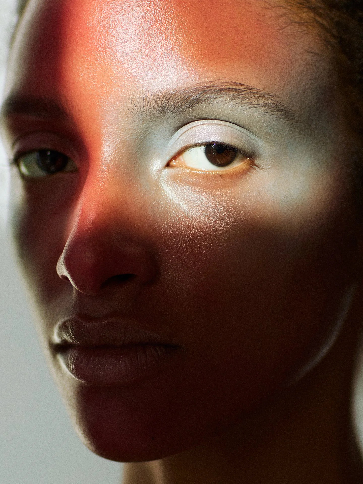 Artistic colour light beauty makeup portrait by a beauty photographer based in Warsaw, Poland