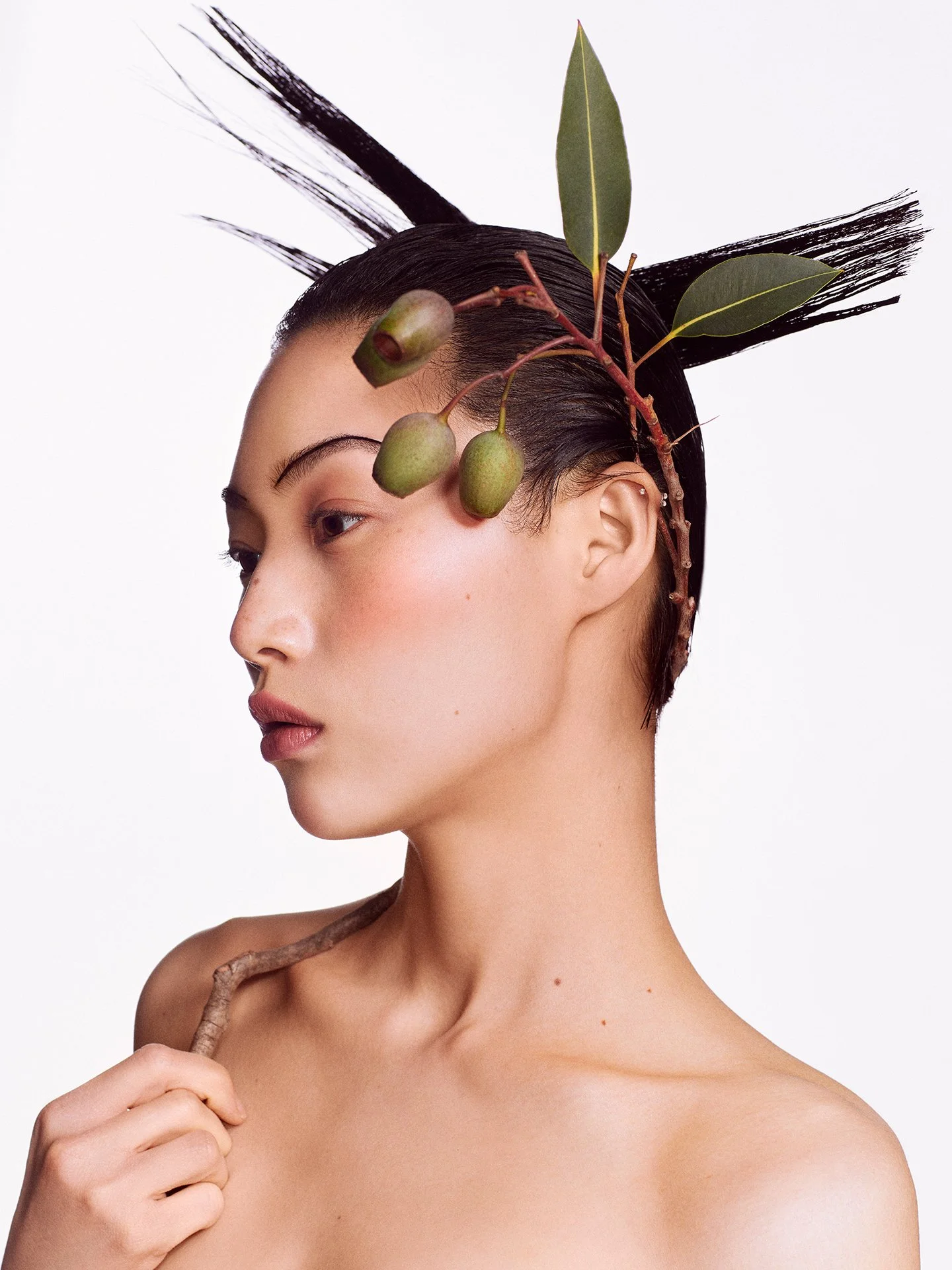 Editorial floral headpiece beauty portrait by a beauty photographer working in London and Europe
