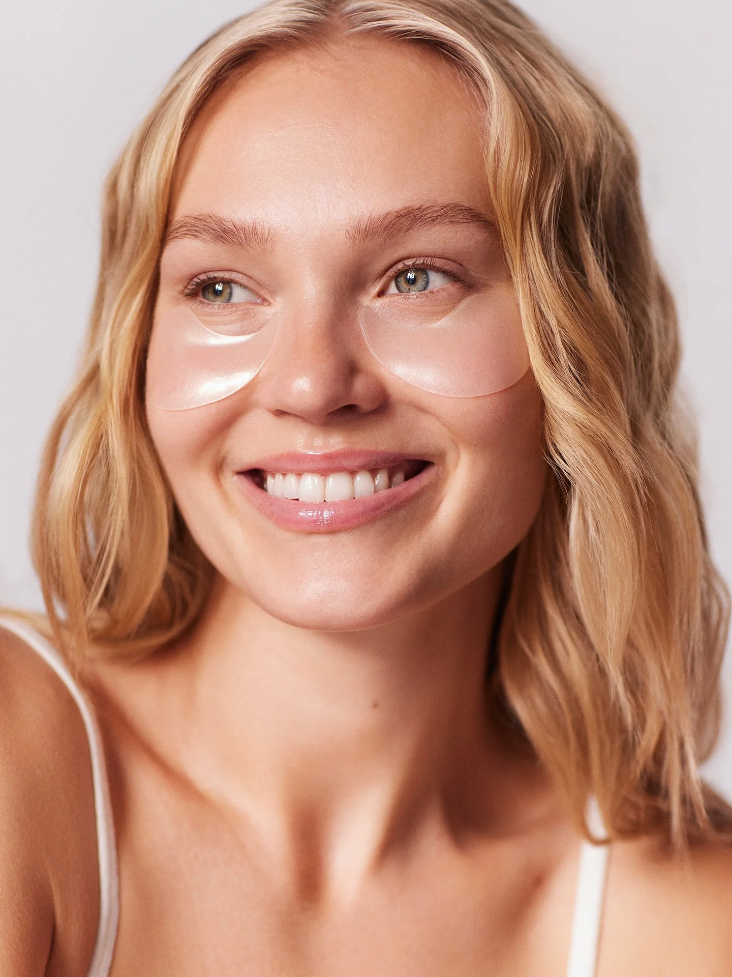 Under-eye skincare patches beauty portrait by a beauty photographer working across Europe