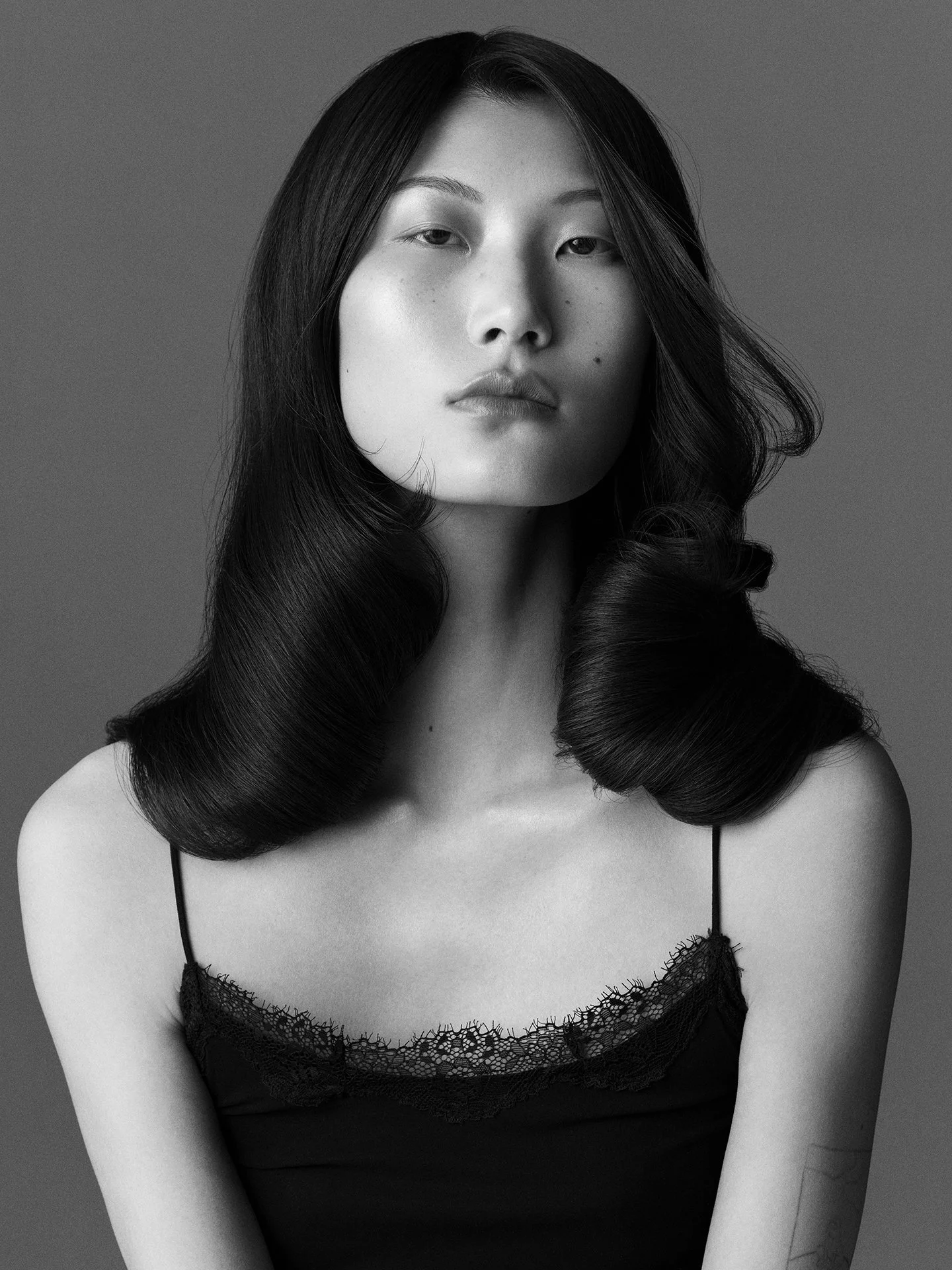 Black and white sculptural hair beauty portrait by a beauty photographer based in Warsaw, Poland