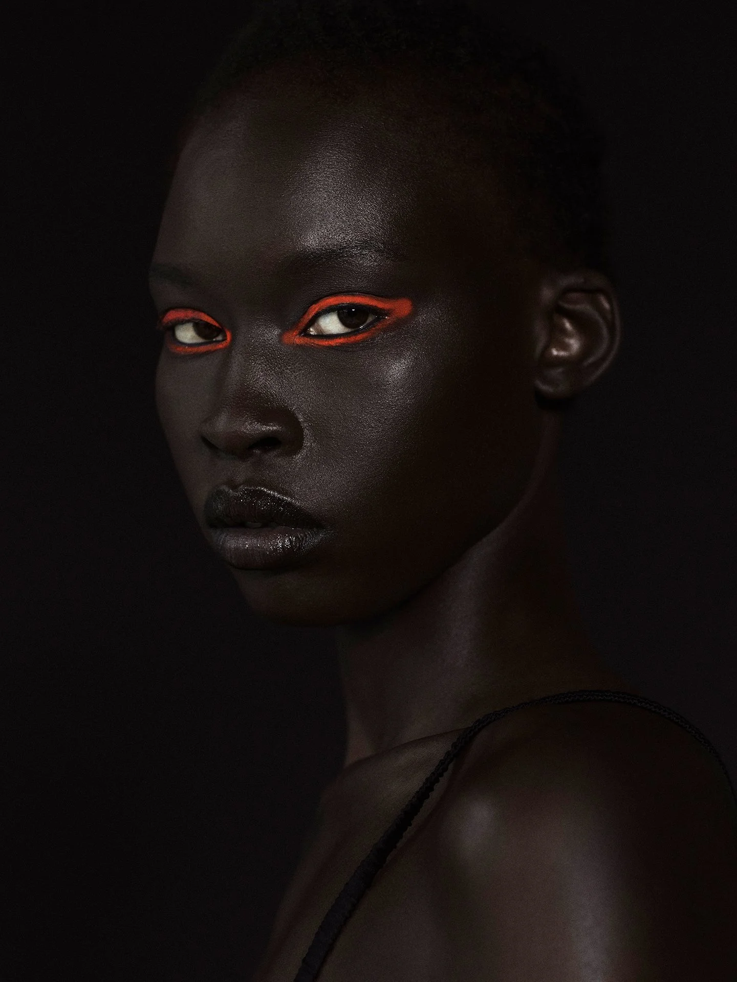 Bold red eyeliner beauty makeup portrait by a beauty photographer based in Warsaw, Poland