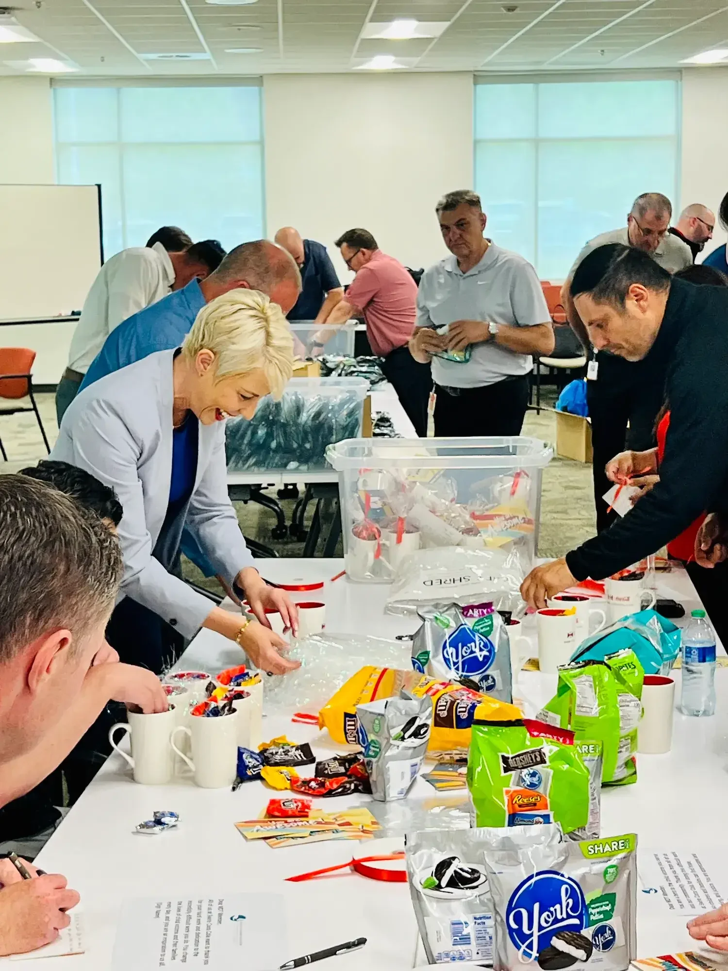 A group of people packaging candy for a service project.
