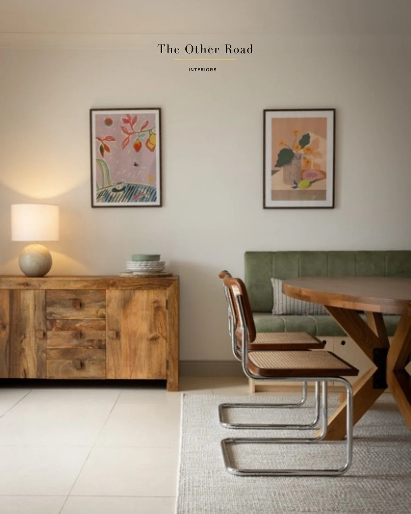 This dining corner is a quiet balance of form, function, and feeling. 

Natural textures from the warm wood grain to the tactile upholstery and woven cane invite the senses. The art adds personality. The shapes add rhythm. And the space itself tells 